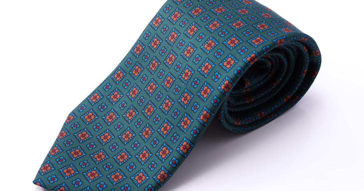 Madder Silk Tie in Green with Blue Orange Motif by Fort Belvedere