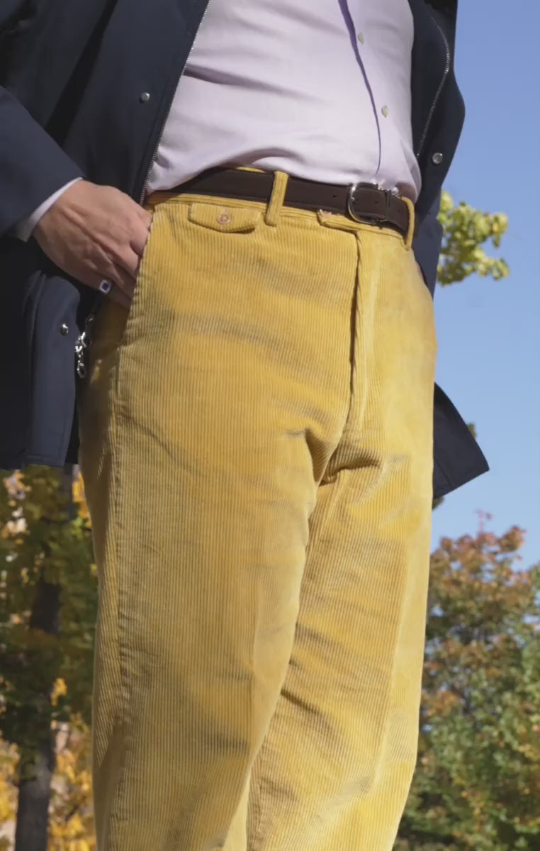 Looping video of a model wearing a dark brown suede belt