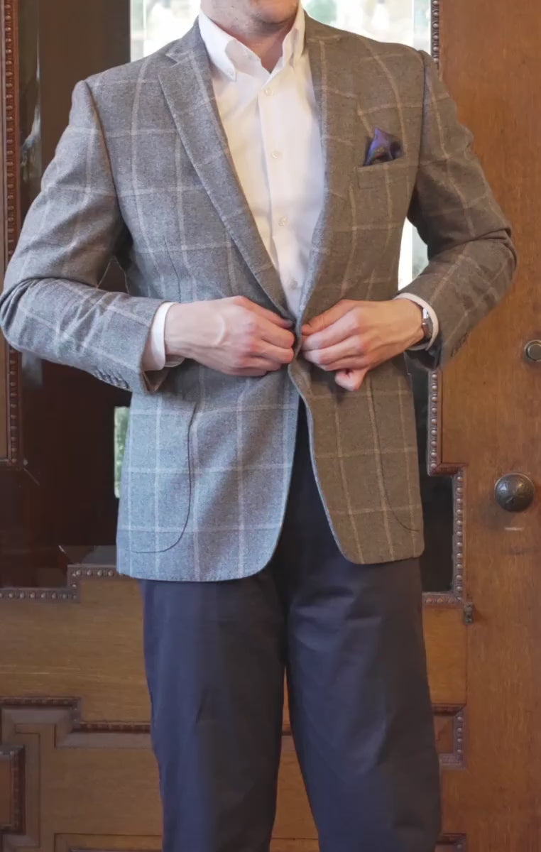 Purple pocket square worn with a gray coat