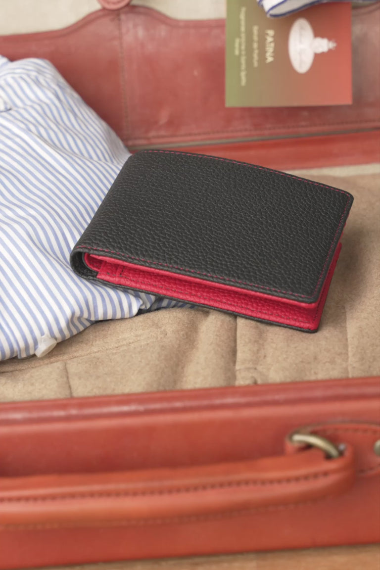 Looping video of a red and black leather wallet