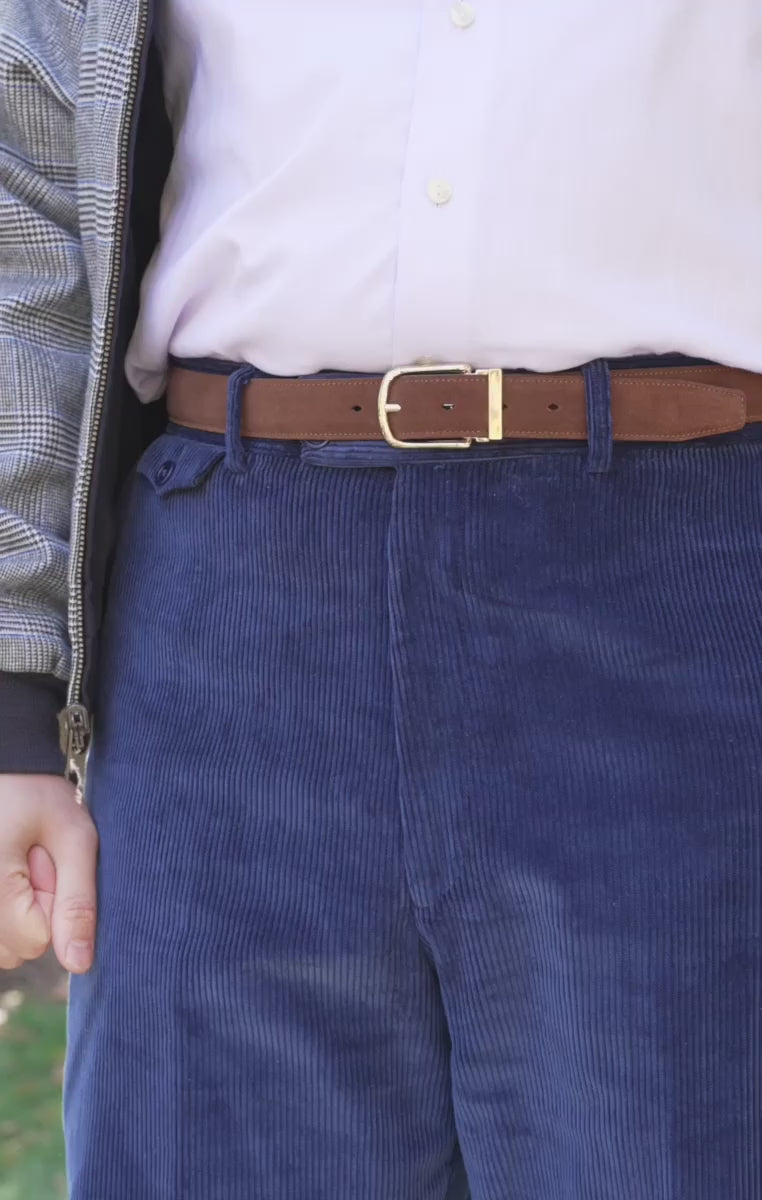 Looping video of a model wearing a medium brown suede belt