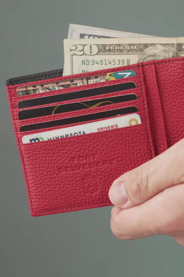 Looping video of a black and red leather wallet
[variants=46675515179262]