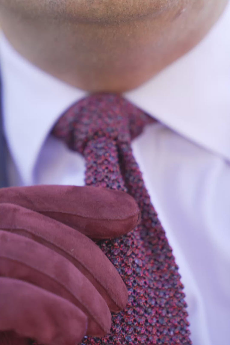 Looping clips of a silk knit tie