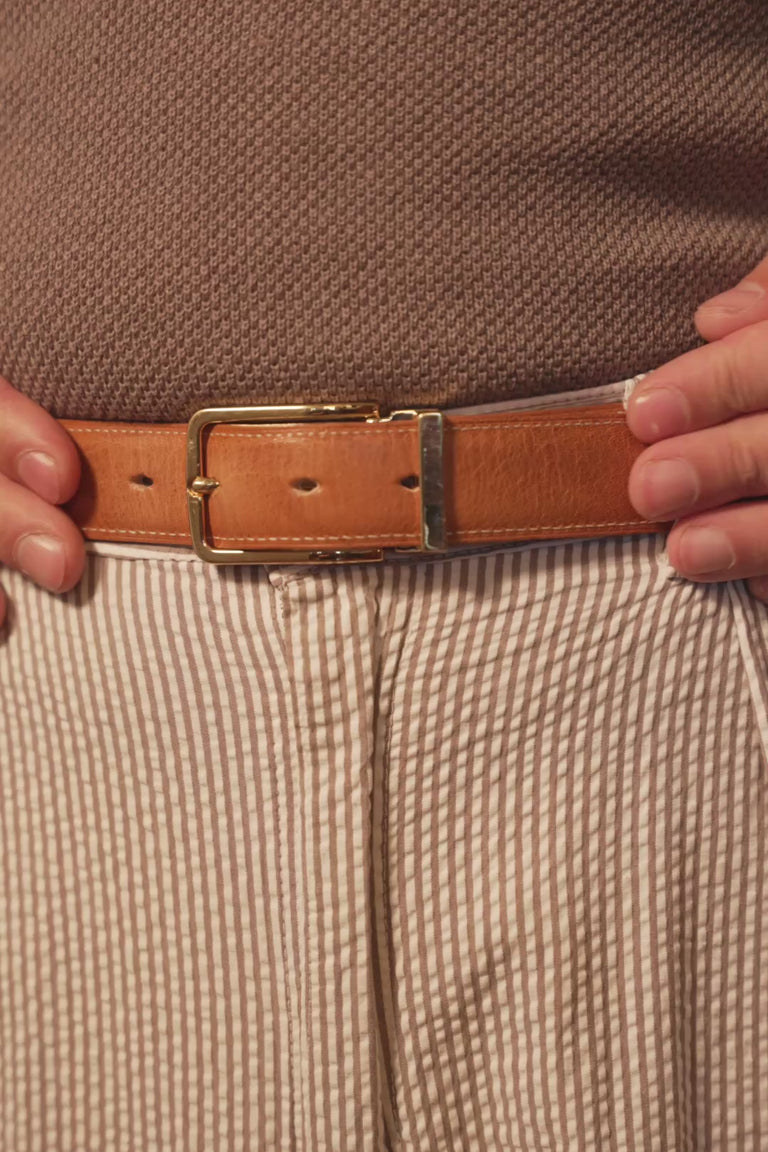 Repeating video of a man wearing White Boxcalf & Undyed Natural Veg-Tan Leather Belt