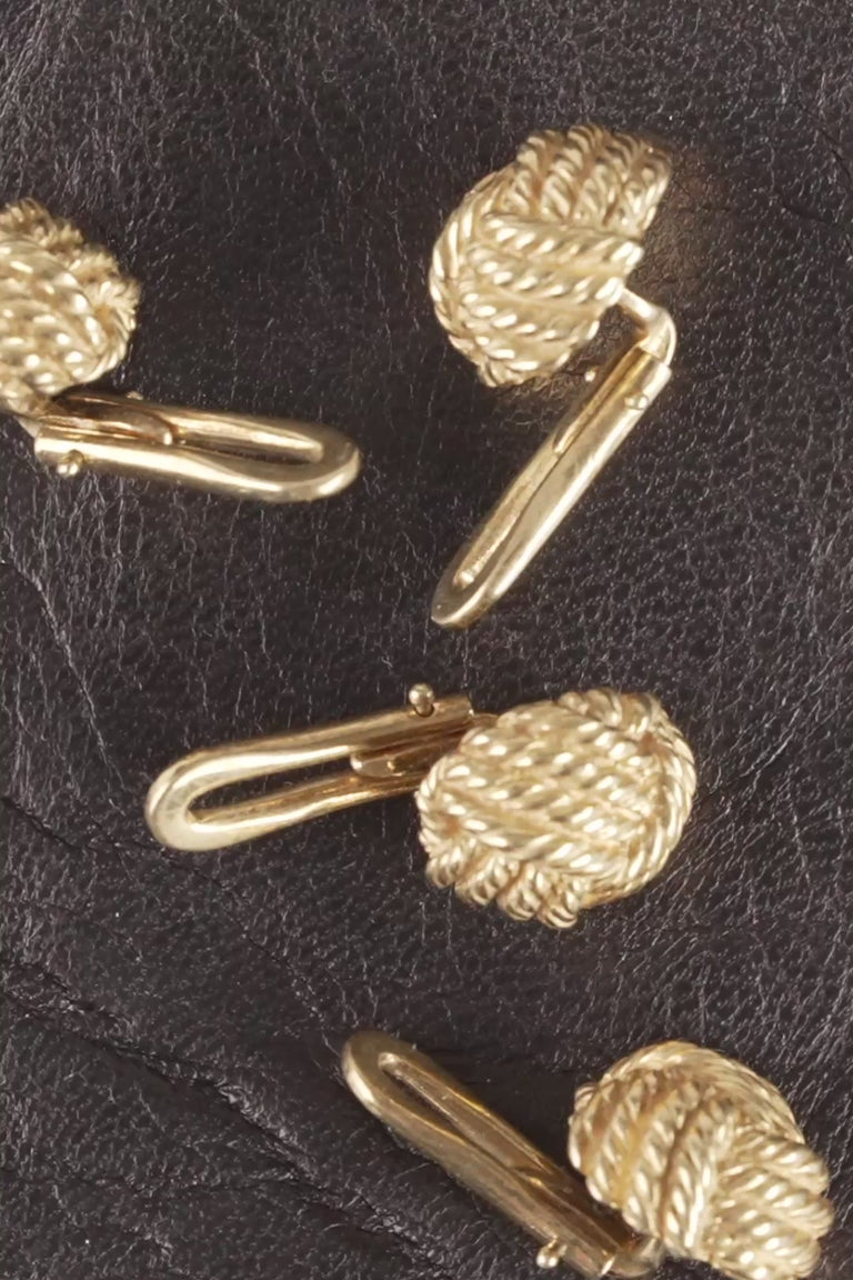 Looping video of yellow gold monkey's fist knot studs