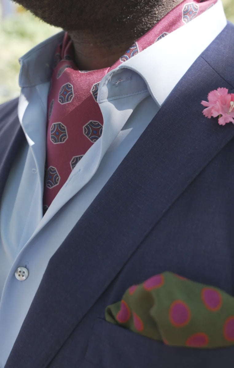 Looping video of models wearing the ascot