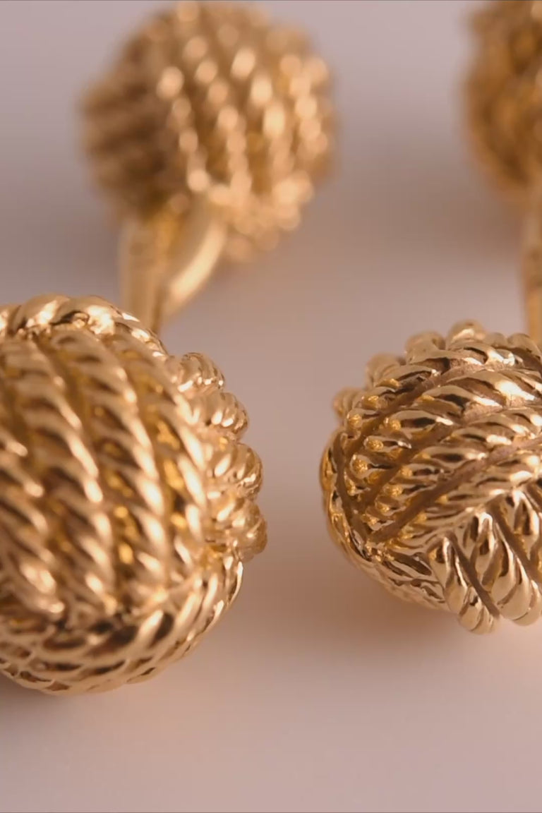 Looping video of yellow gold monkey's fist knot cufflinks