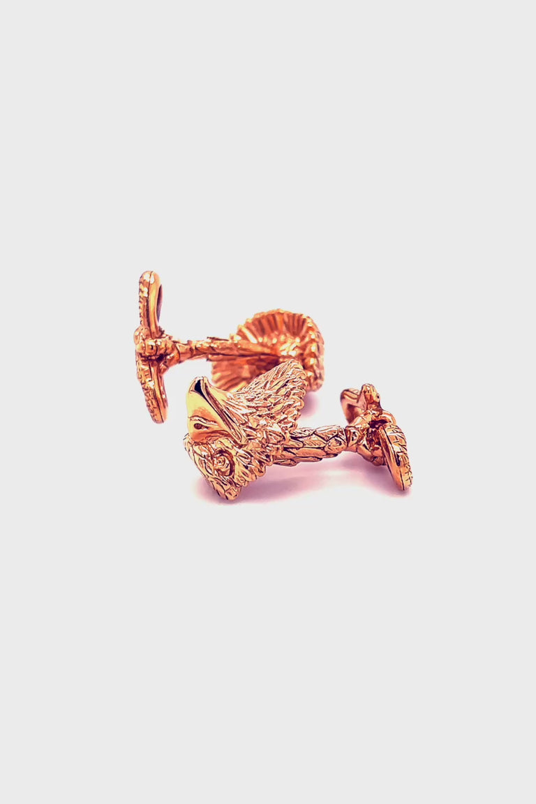 Rotating video of rose gold eagle head cufflinks