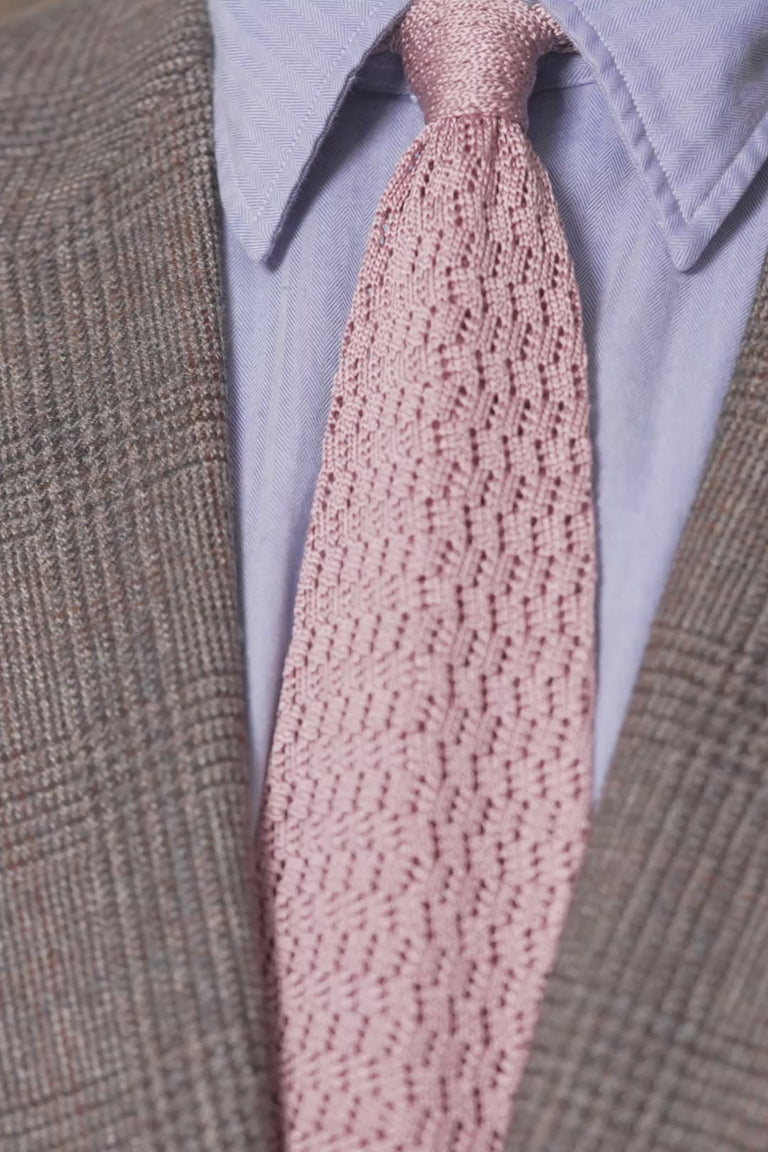 Looping images of a vintage pink silk knit zigzag tie