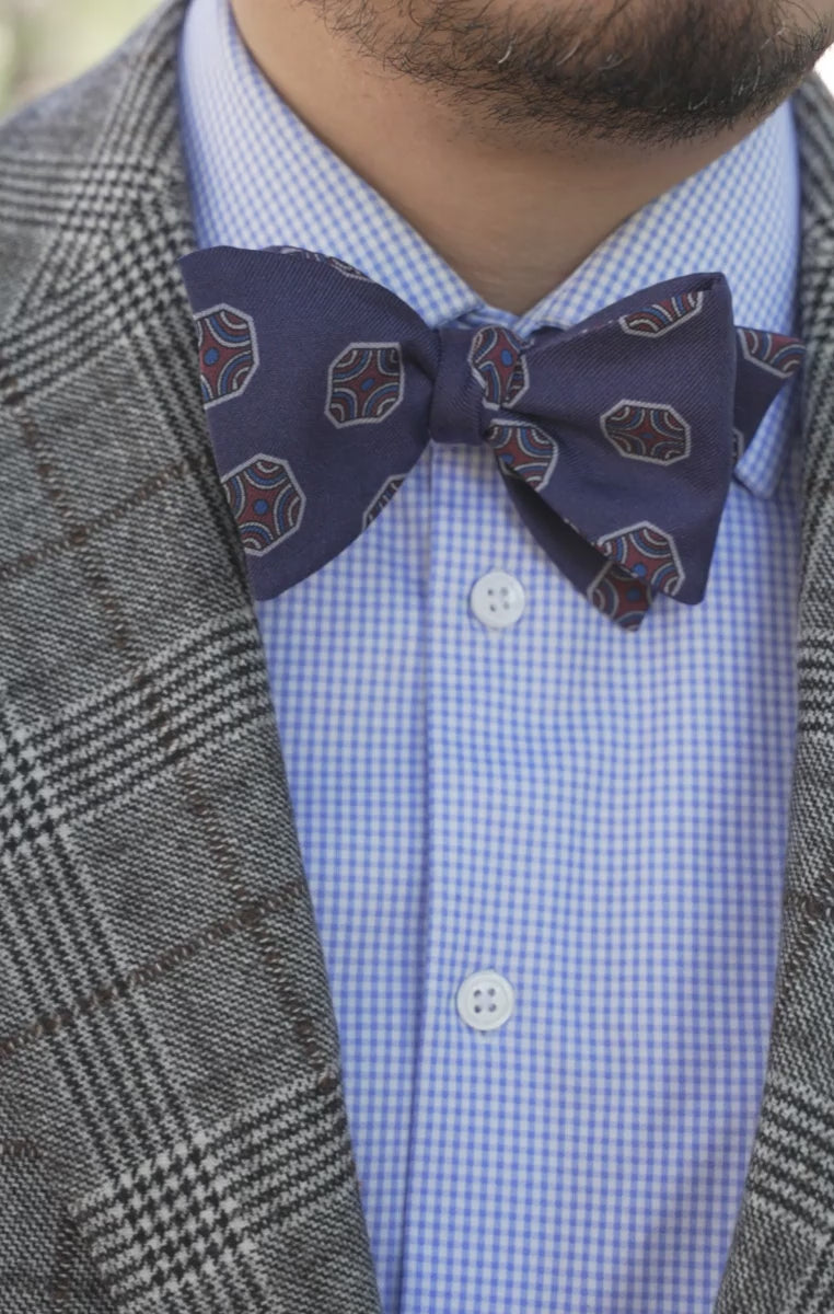 Looping video of models wearing the bow ties