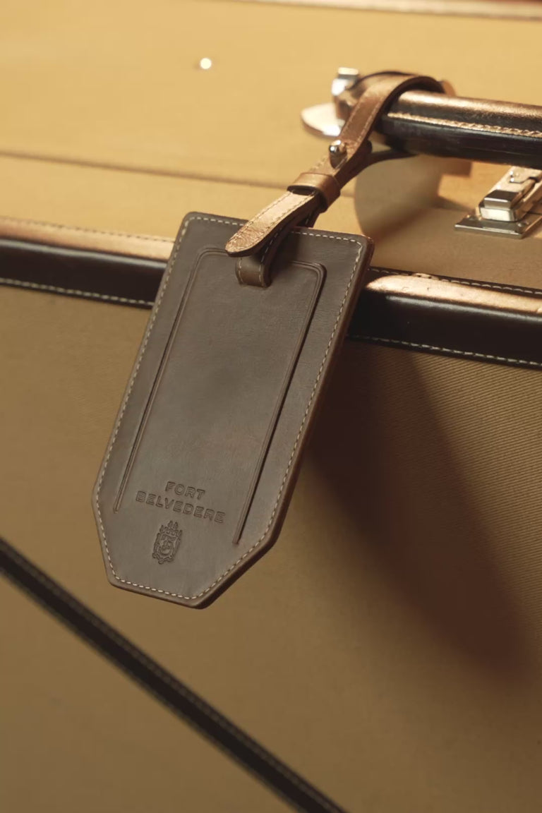 Looping video of a Fort Belvedere antique mahogany montecristo leather luggage tag