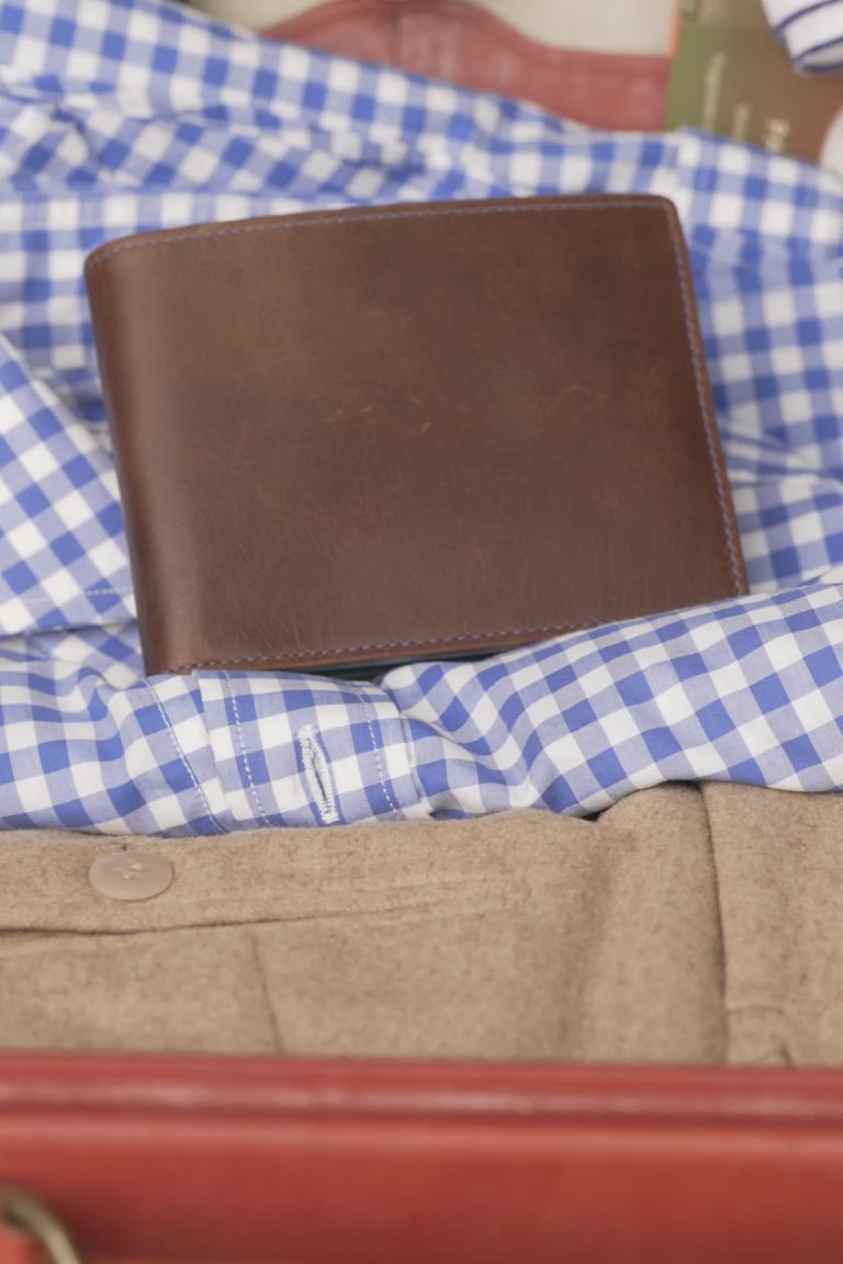 Looping video of a blue and brown wallet