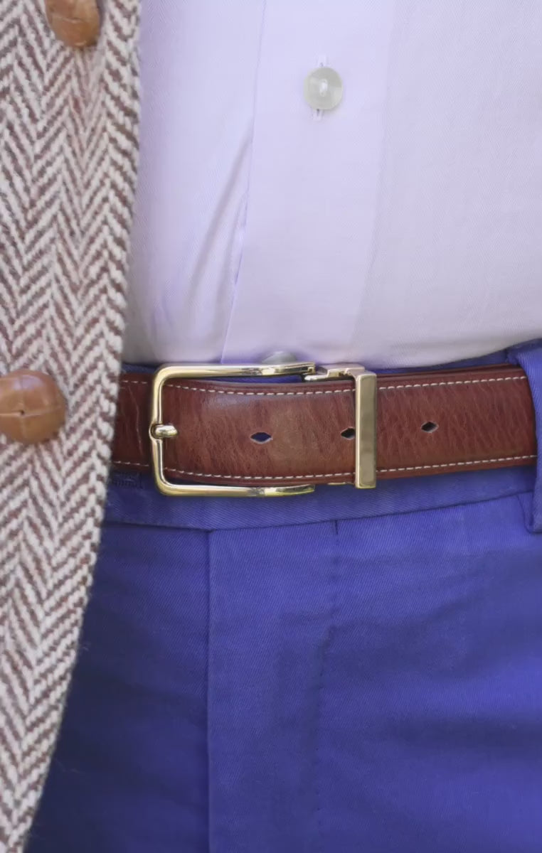 Looping video of a model wearing a natural brown belt