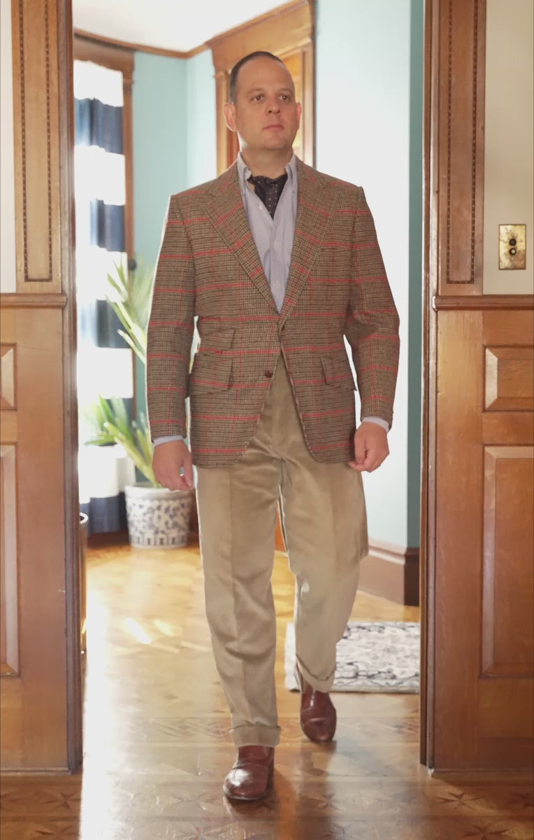 Lifestyle shot of Sven Raphael Schneider walking inside wearing a sport coat outfit with the Pale Taupe Corduroy Trousers by Fort Belvedere