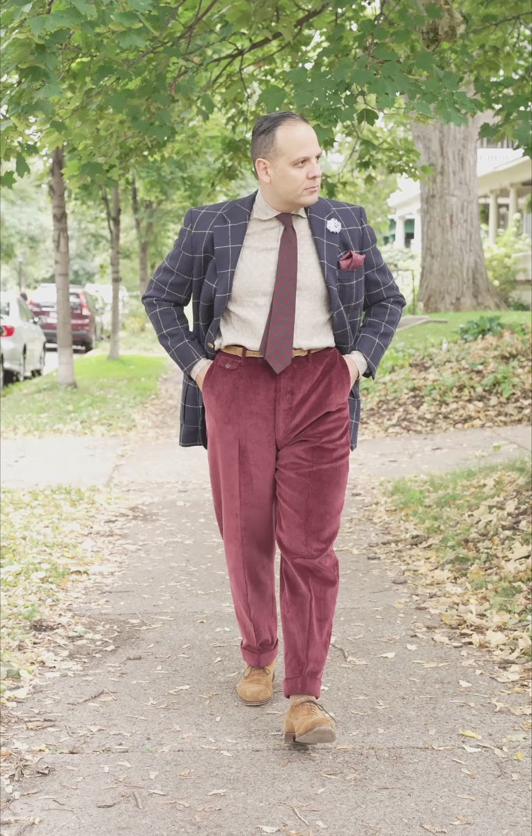 Lifestyle shot of Sven Raphael Schneider walking outside wearing a sport coat outfit with the Maroon Corduroy Trousers by Fort Belvedere