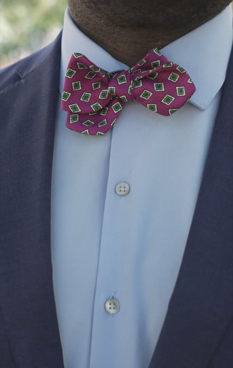 Looping video of models wearing the bow tie