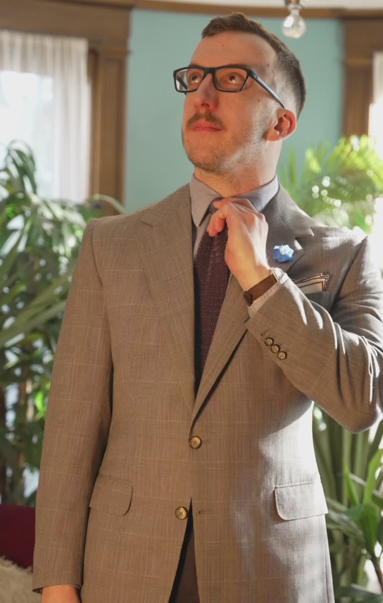 Video featuring models wearing Brown and blue knit tie