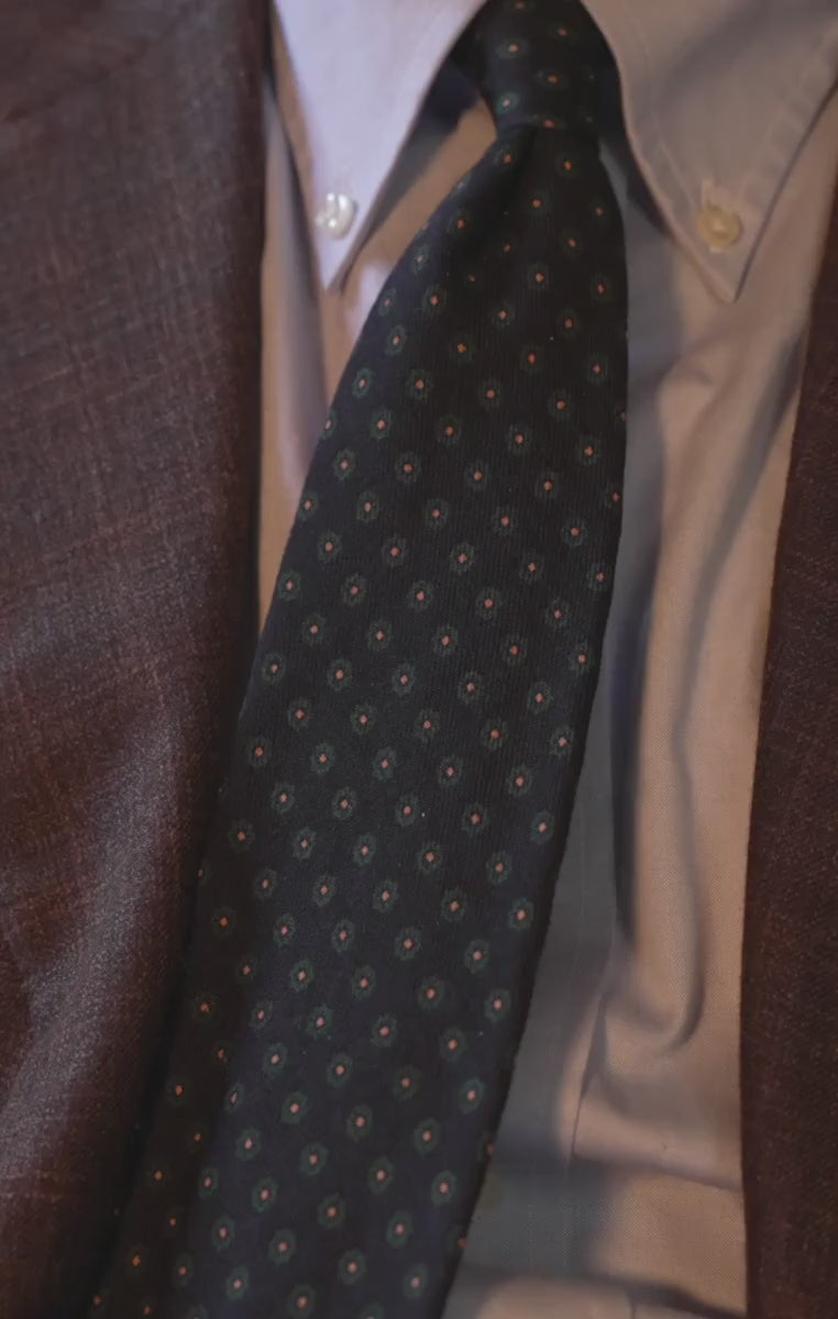 Navy blue tie worn with a white shirt