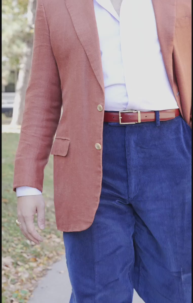 Looping video of models wearing a burnt umber belt