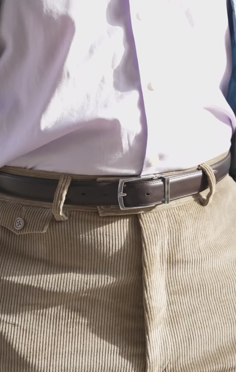 Looping video of a model wearing a charcoal brown belt