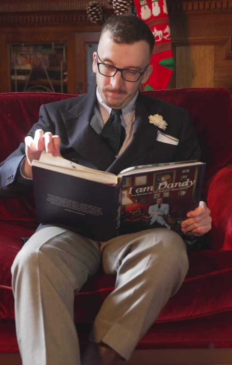 Looping video of a man wearing a cream gardenia 