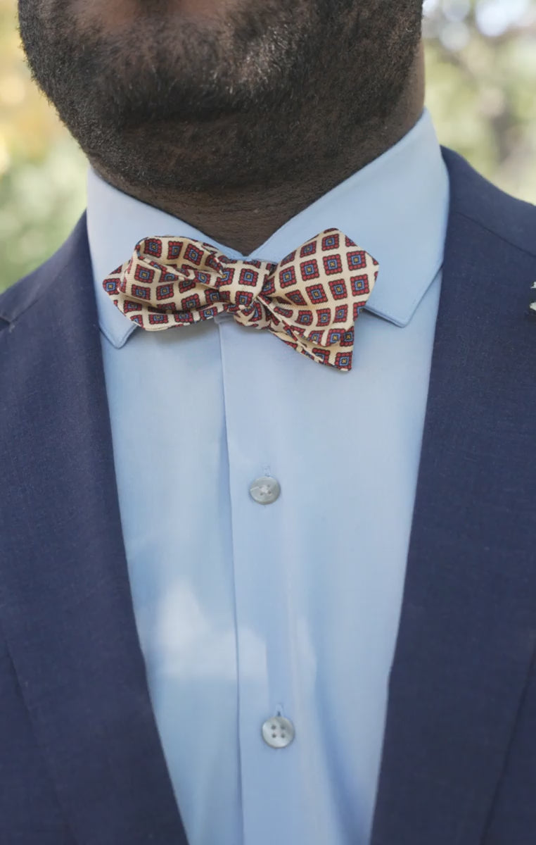 Looping videos of the models wearing the bow tie