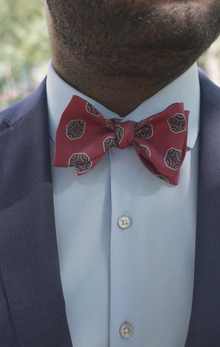 Looping video of models wearing the bow tie