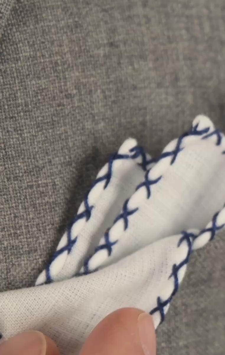 Video of white pocket square with blue x stitch border